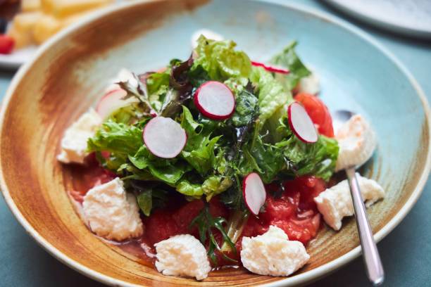 istock Salad of fish and vegetables. A festive table. A dish in a restaurant. 2004448504