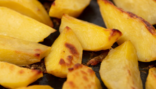 istock Potatoes baked in the oven as a background. 2004470032