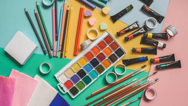 istock Back to school. Panoramic education banner. Top view, flat lay. Colorful supplies on table, colored paper. Children's creativity concept. Preschool study, development. Accessories for the schoolroom 2004474247