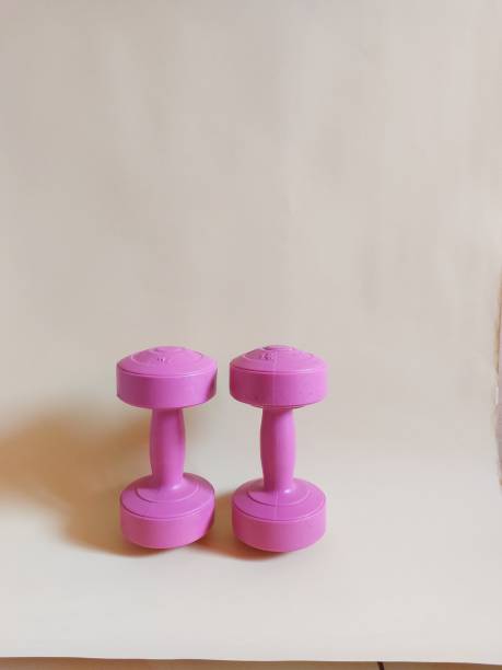 istock Two pink dumbbells isolated on yellow background 2004520428
