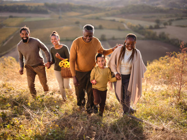 istock Happy black multi-generation family going on a picnic in autumn day. 2004534950