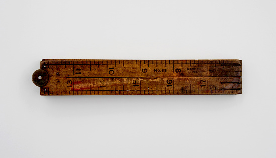 wooden ruler isolated on white background with soft shadow. Ready for use with clipping path. School equipment and measurement image.