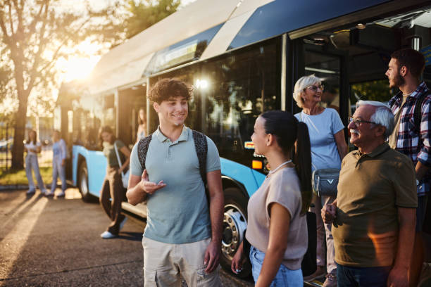 istock Group of commuters leaving the bus at sunset. 2004545513