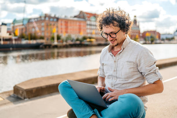 istock Young Man Working On Laptop On The Quayside In Malmo In Sweden 2004559978