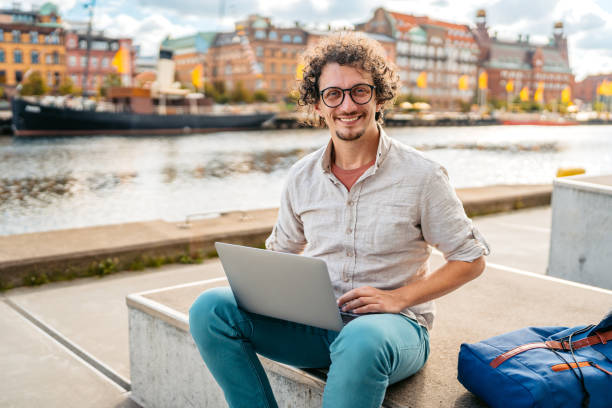istock Young Man Working On Laptop On The Quayside In Malmo In Sweden 2004561013