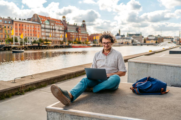 istock Young Man Working On Laptop On The Quayside In Malmo In Sweden 2004561621