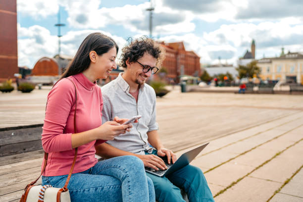 istock Two Students Discussing Their Class Notes On A Laptop On The Quayside In Malmo In Sweden 2004569715
