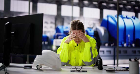 Unhappy Tired Woman Working In Power Plant Electricity Generation