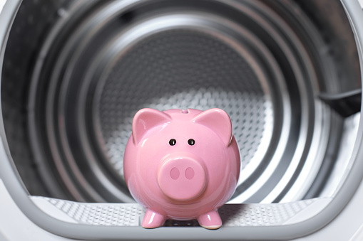 Piggy bank inside washing machine.