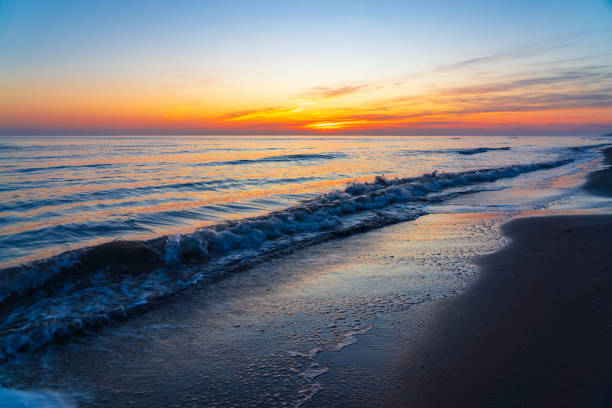 istock Brightly colorful sunrise on the sea coast 2004607221