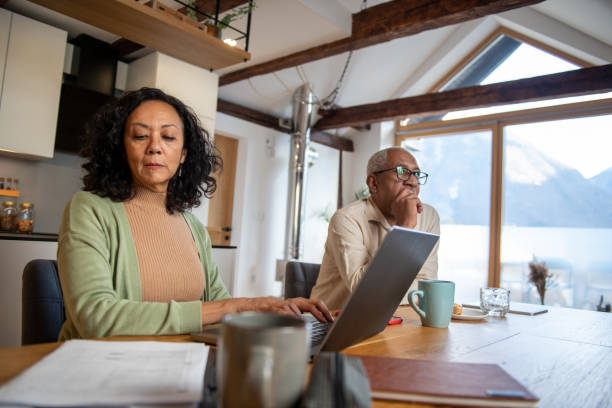 istock Senior couple working from home 2004630928
