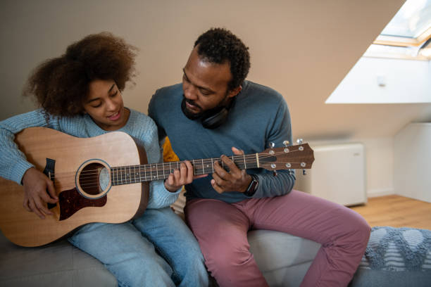 Guitar lessons at home stock photo