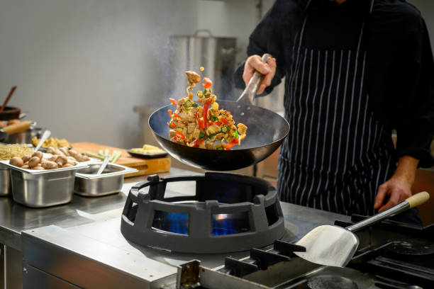 istock Chef preparing food in restaurant kitchen 2004635666