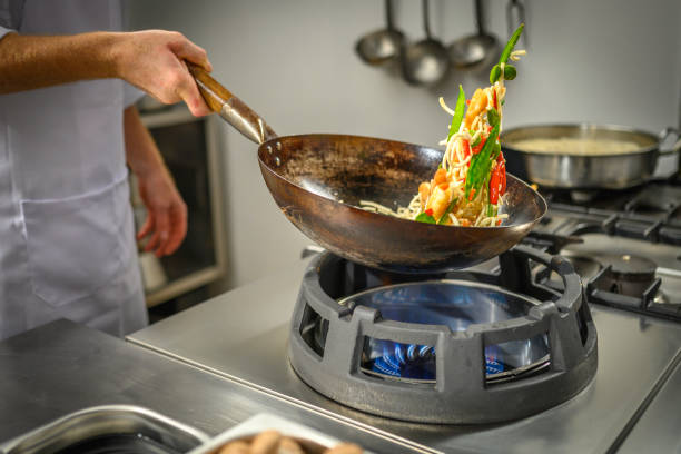 istock Chef preparing food in restaurant kitchen 2004635677
