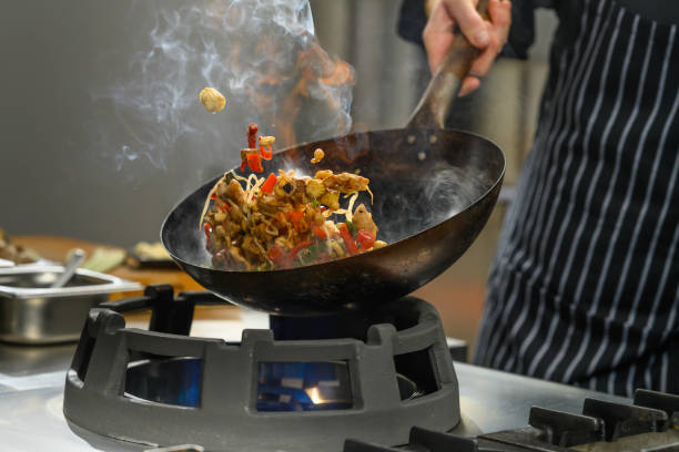 istock Chef preparing food in restaurant kitchen 2004635678