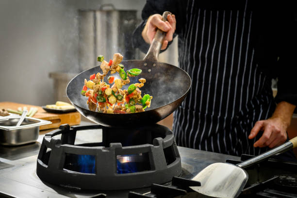 istock Chef preparing food in restaurant kitchen 2004635679