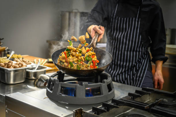 istock Chef preparing food in restaurant kitchen 2004635684