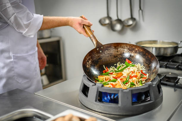 istock Chef preparing food in restaurant kitchen 2004635686