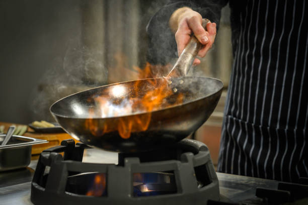 istock Chef preparing food in restaurant kitchen 2004635702