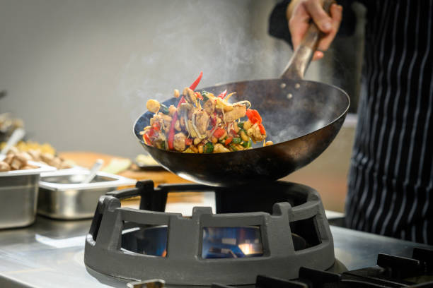 istock Chef preparing food in restaurant kitchen 2004635716