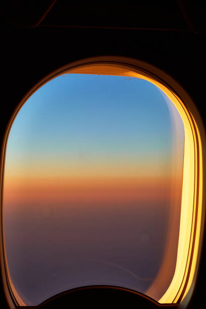 istock Sunset view from window of aricraft 2004646325