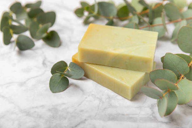 istock Soap on a texture background. Soap with eucalyptus extract and natural herbs on a white background. Beautiful Natural soap bars. Handmade organic soap concept. Skin care. banner 2004657868