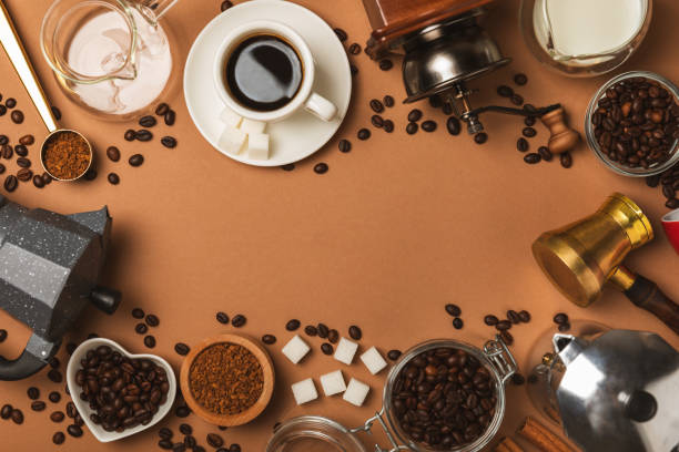istock Ingredients for making coffee. Moka pot, Turkish coffee pots (cezve), coffee grinder with coffee beans, milk, sugar and spices on a white background. Drink preparation concept. Flat Lay.Copy space. 2004664697