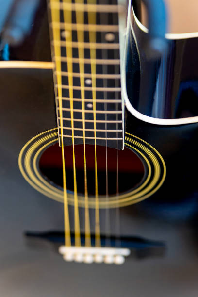 istock a black wooden guitar with a view from above 2004700534