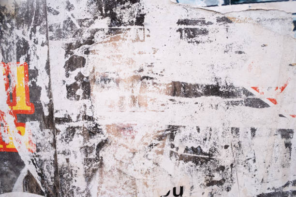 istock Torn and ripped street poster background, artistic paper collage 2004704135