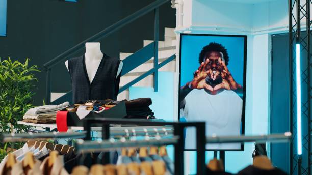 istock Empty modern clothing store filled with formal wear designs 2004707316