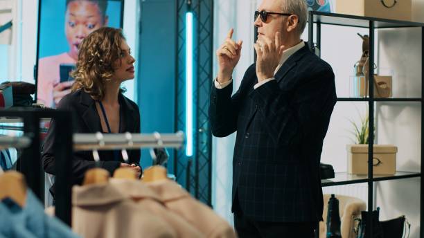 istock Skilled couturier asking for luxury items from store assistants 2004708345