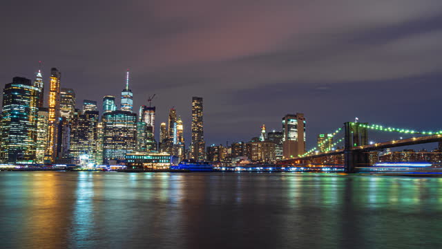 4K Footage Day to Night Time Lapse of Lower Manhattan Financial District cityscape river side with Brooklyn Bridge in New York, United States, USA,Business Financial Industry and Travel Destination