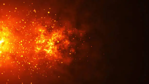 Closeup of burning hot bonfire fire sparks. Fire Particles over black background of fiery orange glowing flying ember burning ash particles.
