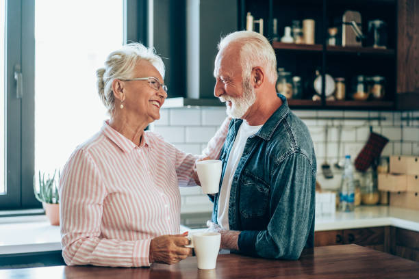 istock Lovely couple drinking coffee at home. 2004738970