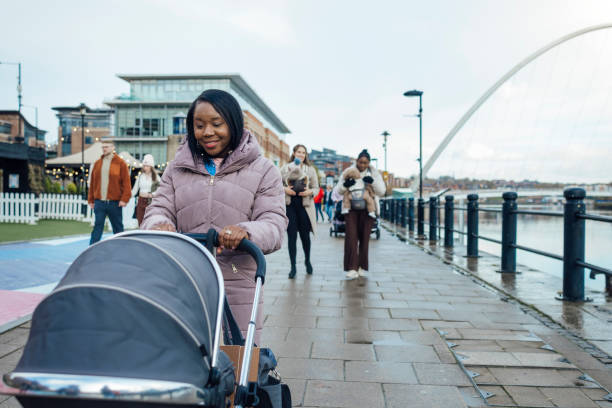 istock Mother and Baby Walks 2004741630