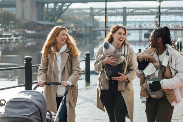 istock Mothers Walking by the River 2004742168
