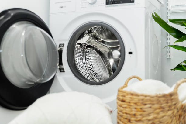 istock Open door of front load washing machine in laundry room. 2004751105