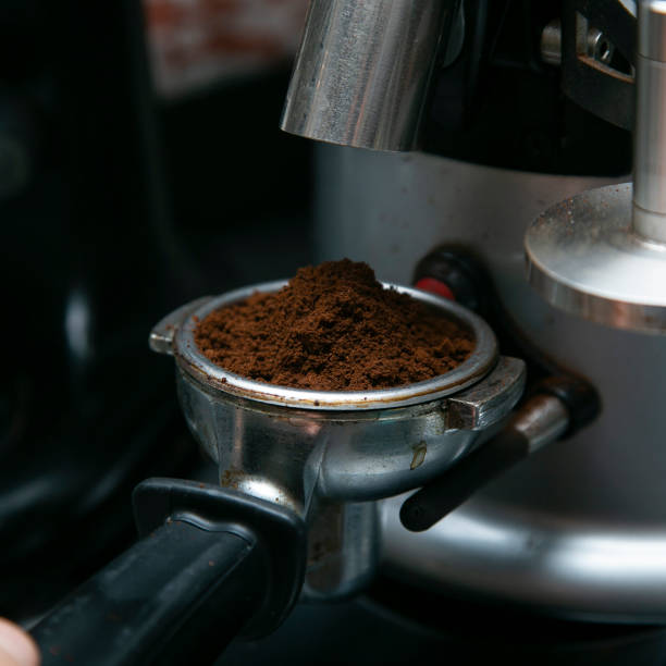 istock Professional barista working with a coffee machine and preparing hot drinks with coffee and milk. 2004751120