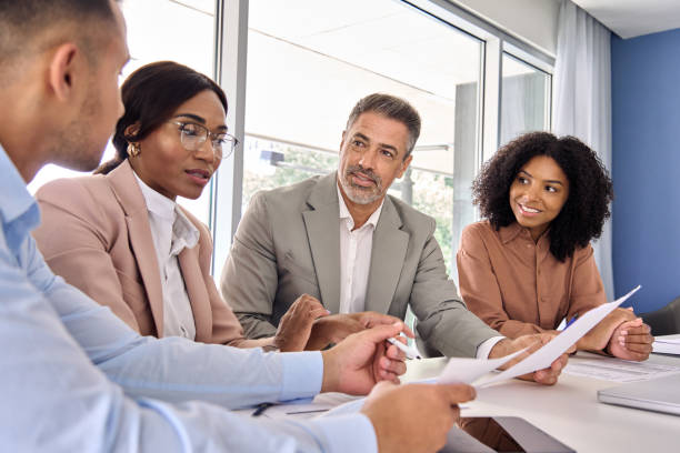 istock Busy diverse executive business people work group consulting at office meeting. 2004777394