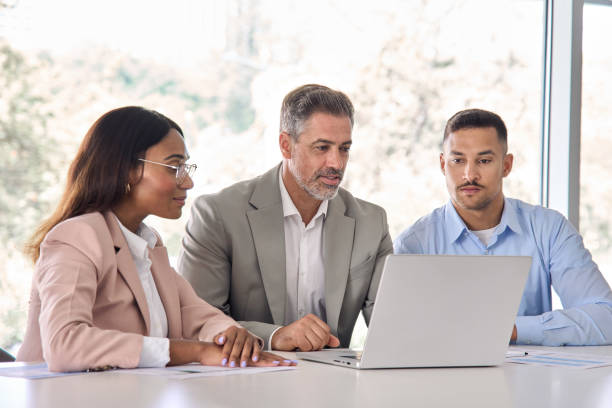 istock Executive business people using laptop working in office at meeting. 2004777408