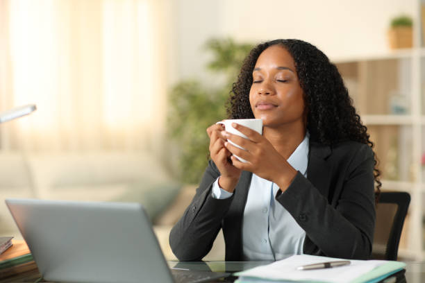 istock Black freelance worker relaxing drinking and breathing 2004781291