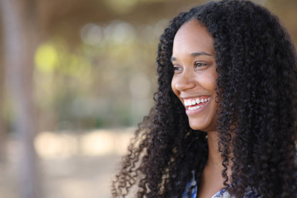 Happy black woman smiling with perfect teeth