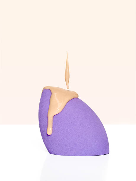 istock Liquid foundation or BB cream pouring on makeup sponge 2004802746