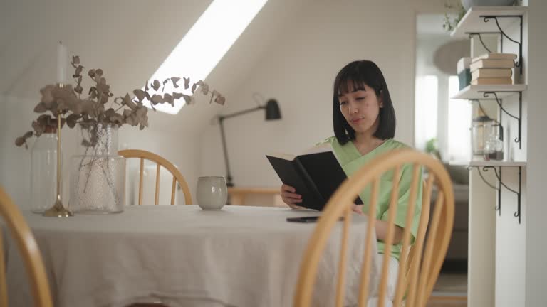 Woman reading a book in the morning