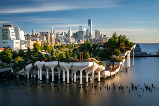 View of downtown Manhattan with the Little Island public elevated park in the foreground. New York City cityscape before the sunset.