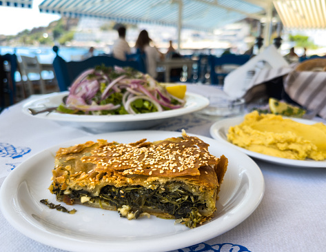 Traditional greek meal: spinach pie, fava beans and green salad.