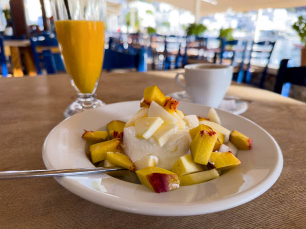 greek yogurt with fruits - beach table peach fruit foto e immagini stock