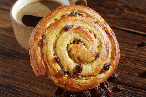 istock Puff pastry raisin bun and coffee 2004819717
