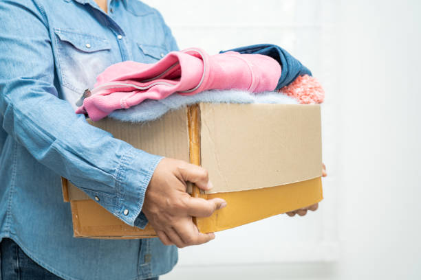 istock Donation box with used clothes at home to support help for poor people in the world. 2004836955