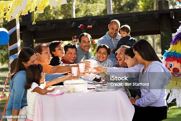 Extended Family Having Toast In Park Stock Photo - Download Image Now - Birthday, Party - Social Event, Latin American and Hispanic Ethnicity